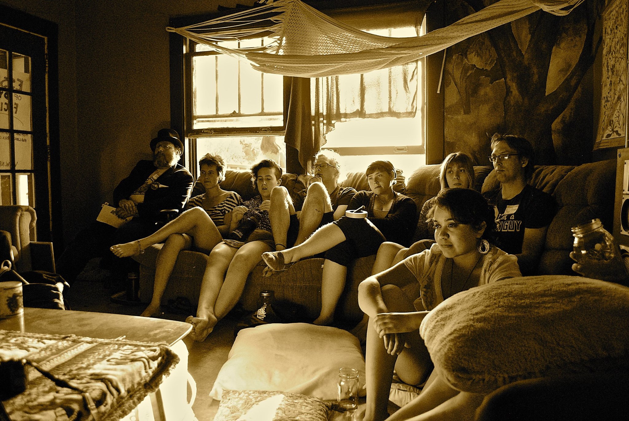 WestCo attendees sit on the floor and couches while listening to workshop facilitators.